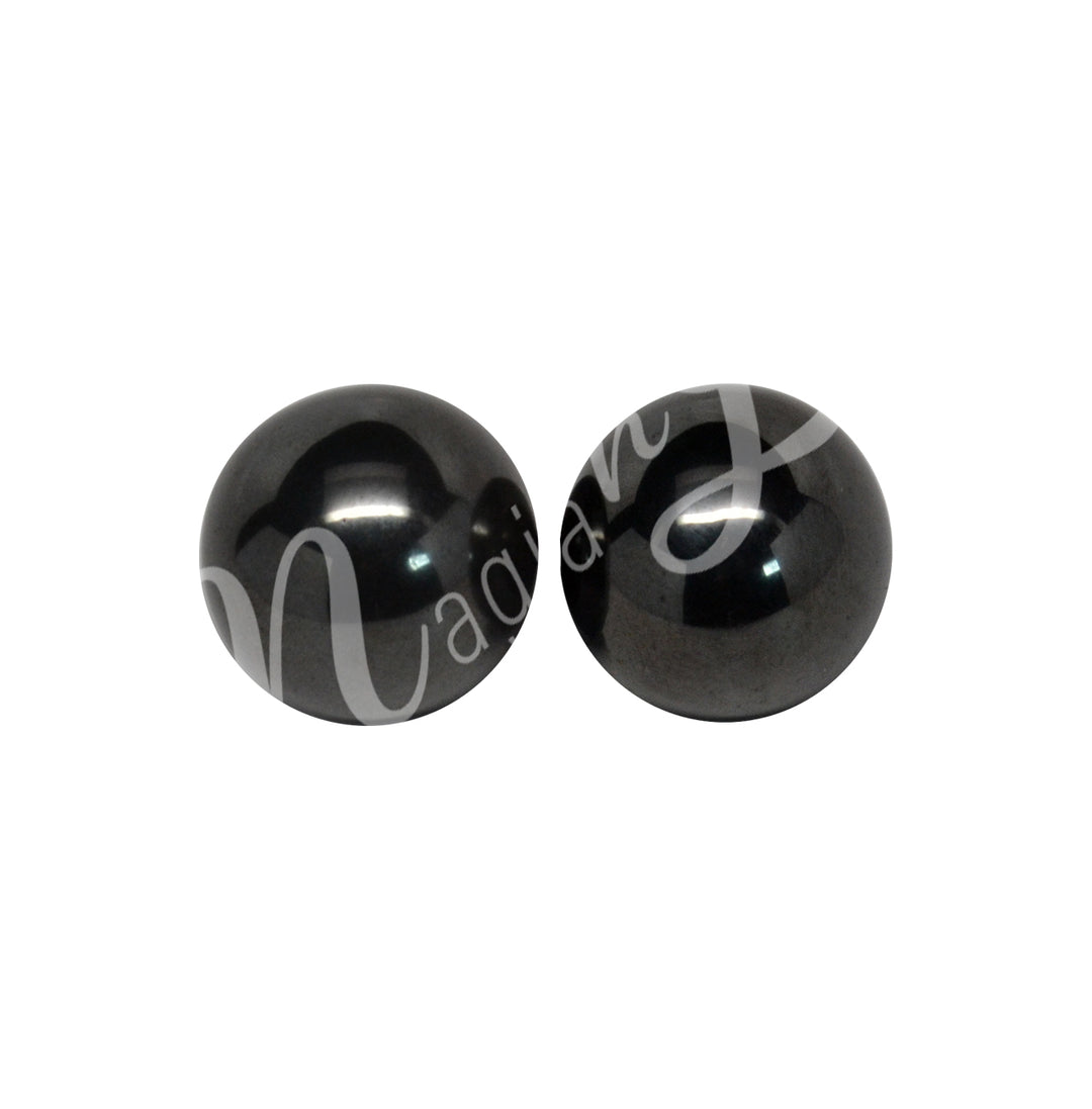 A pair of black hematite spheres.