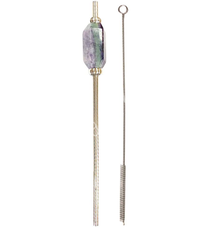 Stainless steel straw with a faceted fluorite stone accent, shown alongside a thin metal cleaning brush with a looped handle.