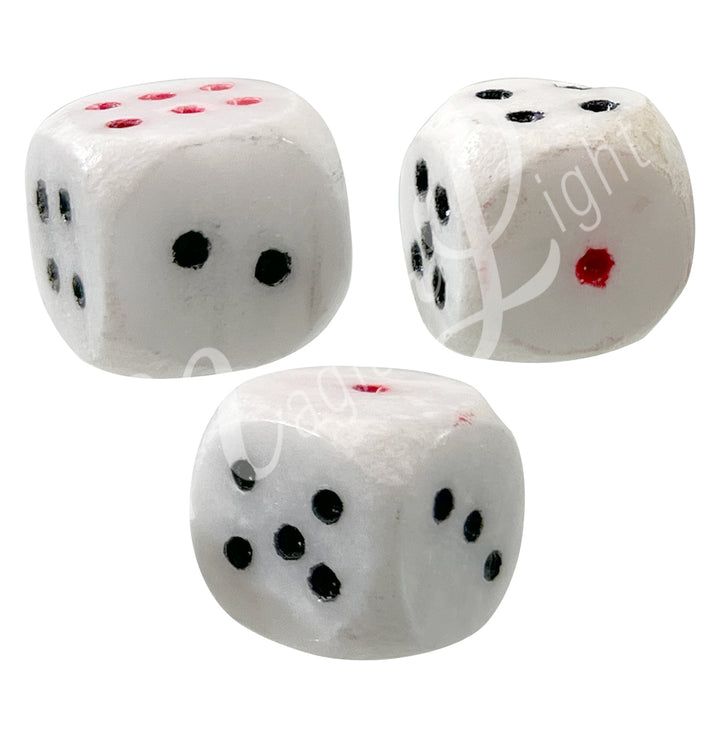 Set of three polished white marble gemstone dice with white engraved dots.