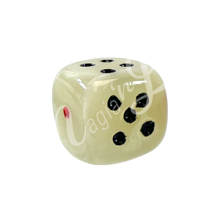 A polished green onyx gemstone dice with white engraved dots.