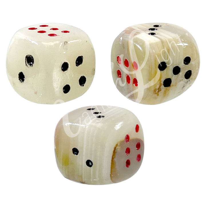 Set of three polished green onyx gemstone dice with white engraved dots.