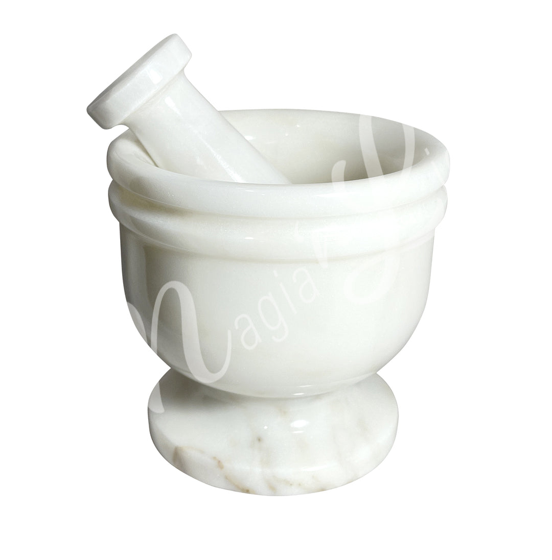 White mortar and pestle set.