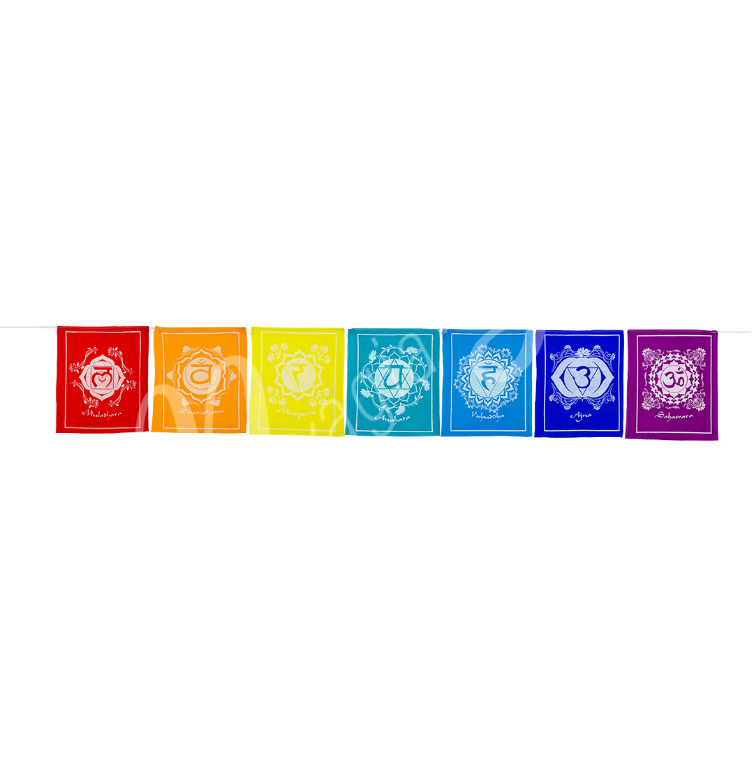 Seven rectangular pieces of fabric in chakra colors with corresponding symbols, placed side by side.