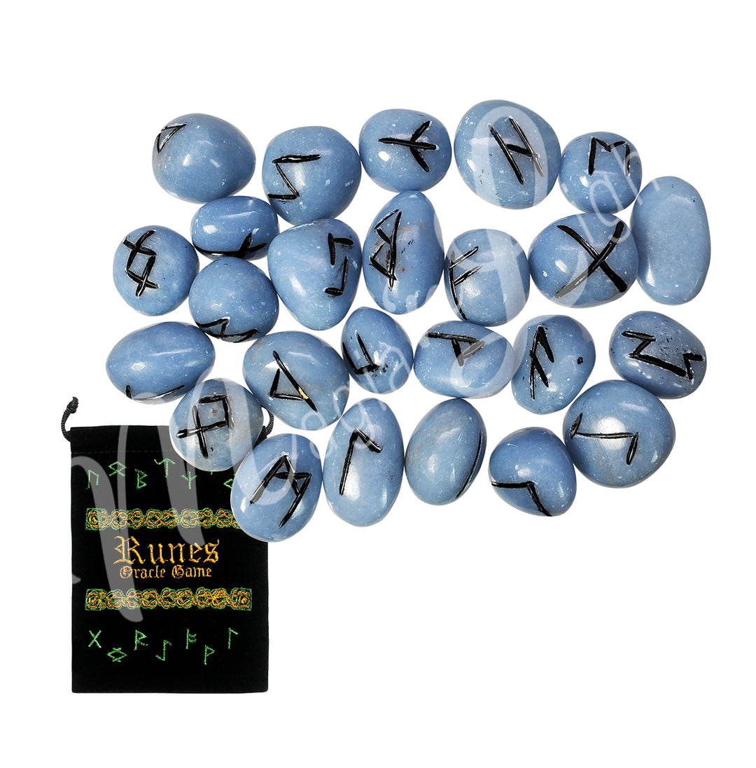 A set of angelite runestones with engraved and painted black symbols, displayed with a black velvet pouch. The pouch is embroidered with the words "runes oracle game", as well as runic symbols.