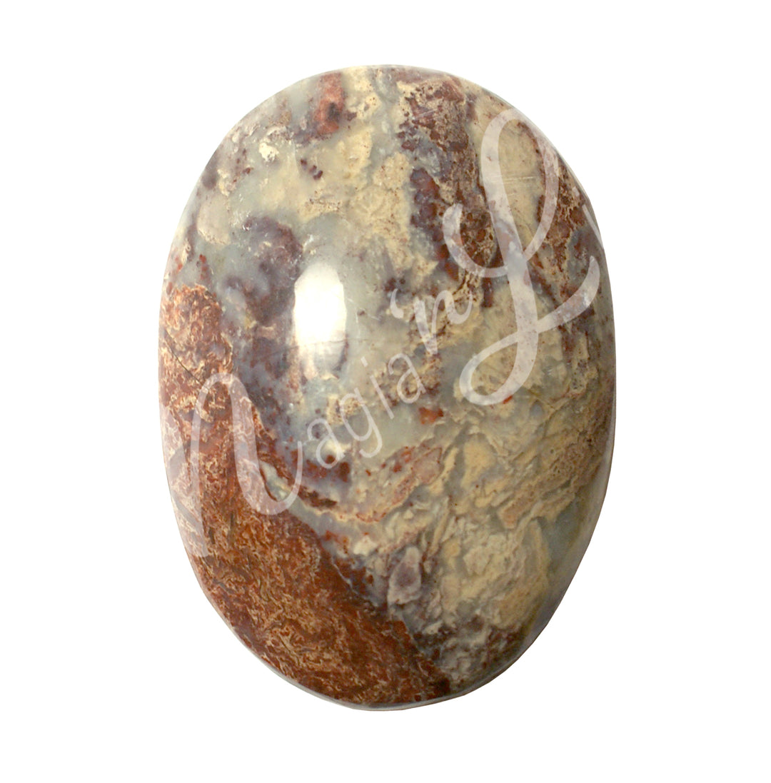Close-up of a polished oval palm stone made of dolomite.