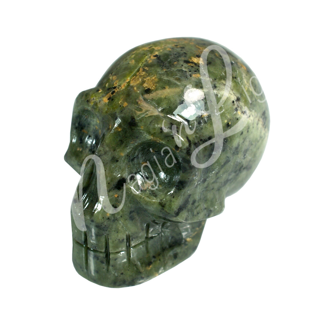 A polished skull carving made of nephrite jade.