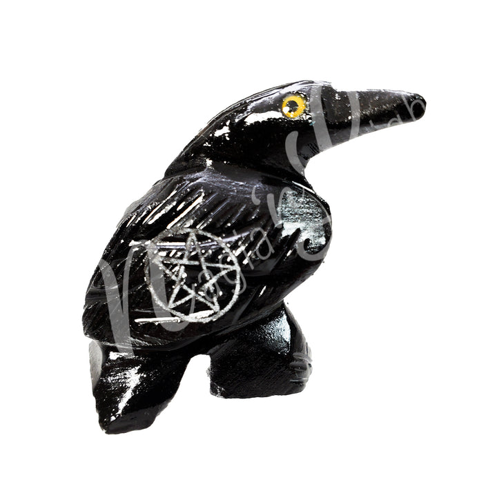 A carving of a raven with a pentacle engraved on its wing, made of black onyx.