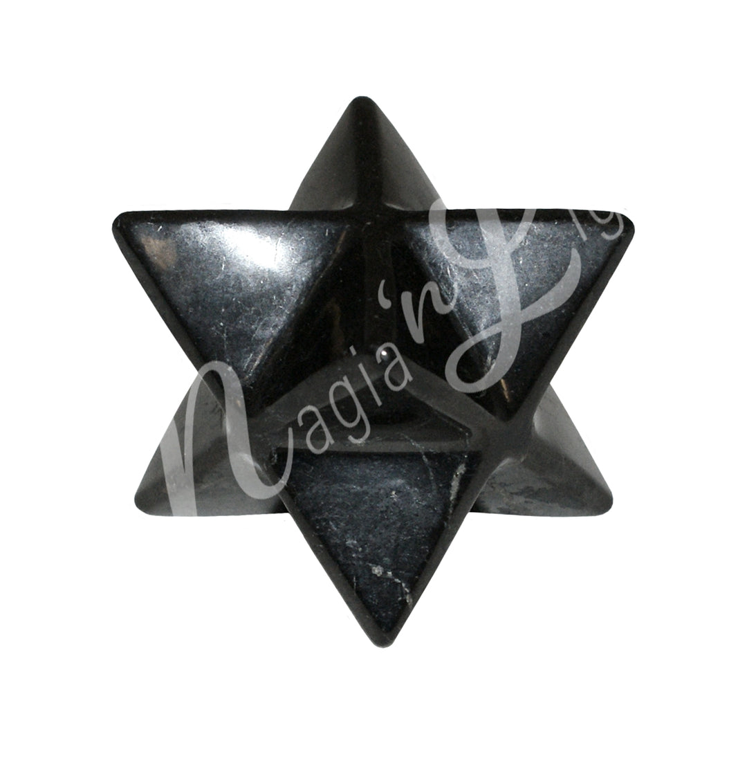 A Black Shungite stone carved into a Merkaba star shape with smooth, polished surfaces.