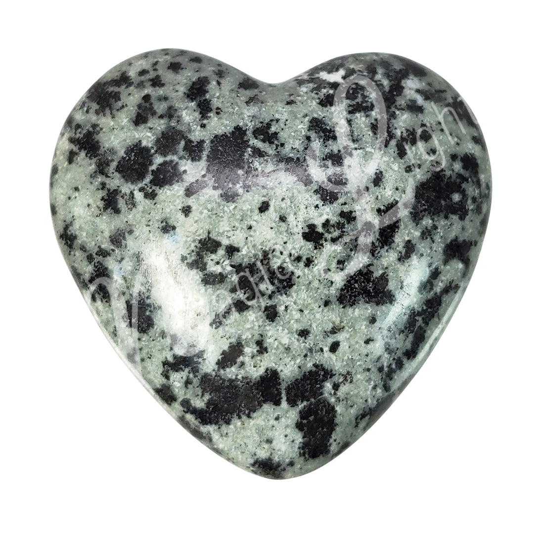 Heart-shaped dalmatian jasper crystal.