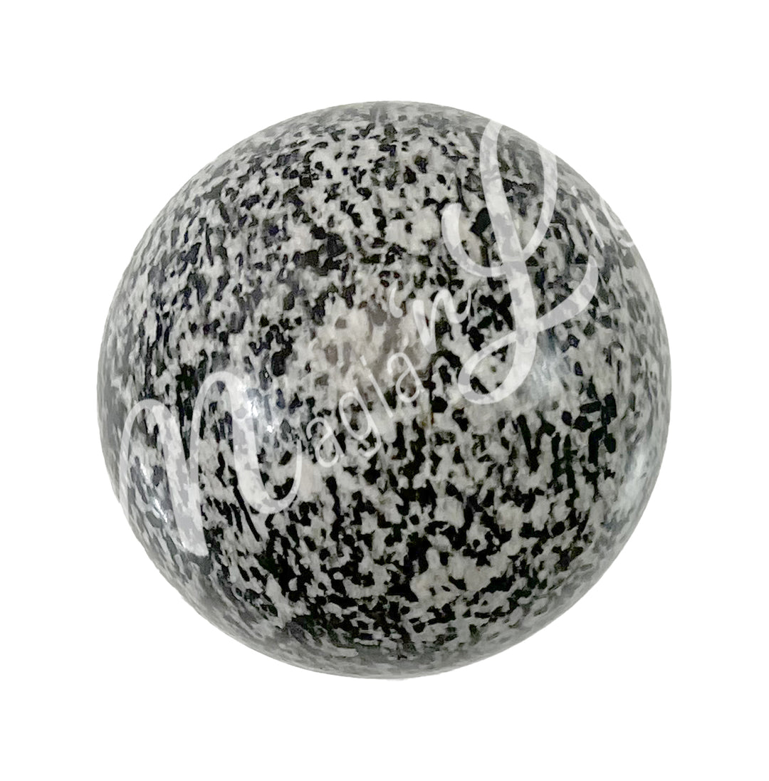 A sphere made of dalmatian jasper.