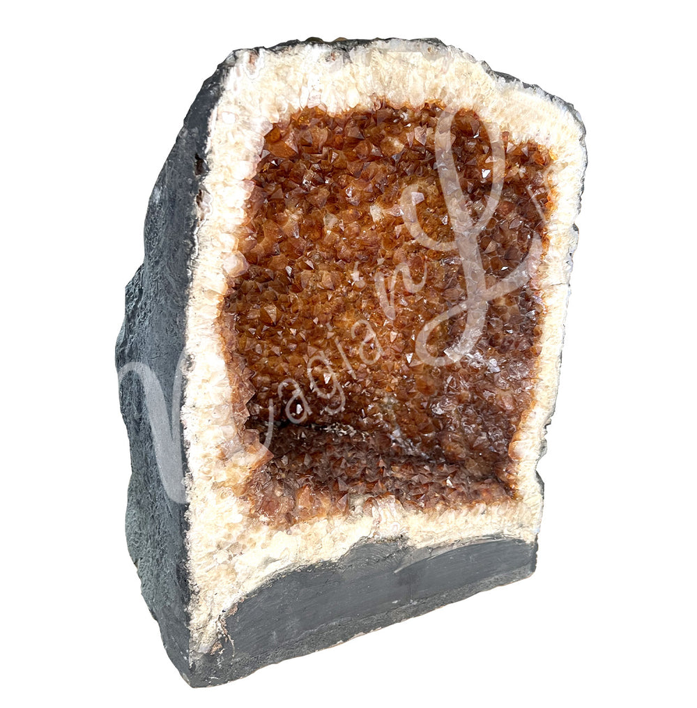 Side view of a citrine cathedral. The center is yellow with glitter while the sides go from white to black on the exterior.