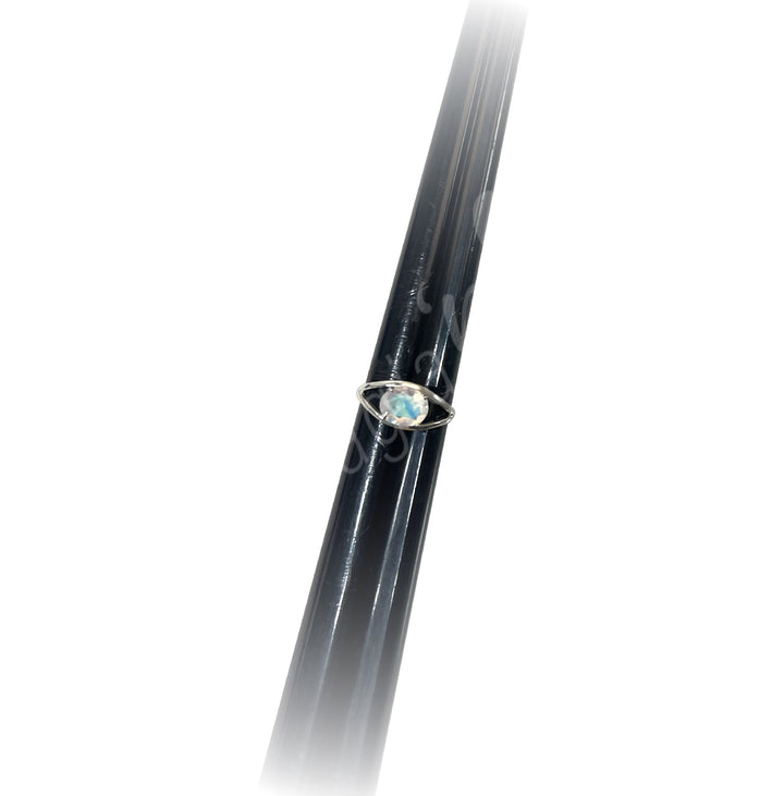 A sterling silver ring with a central Rainbow Moonstone.