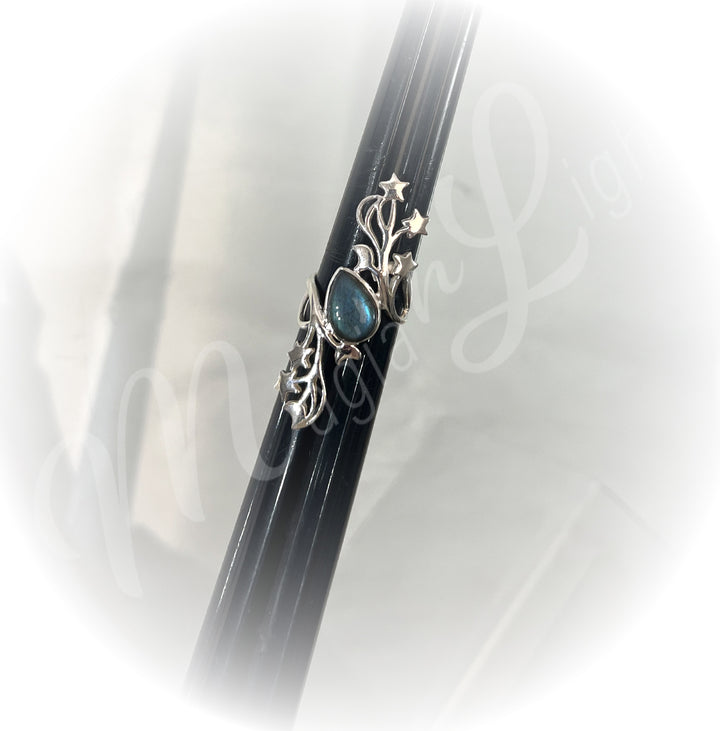 A sterling silver ring with labradorite stone.