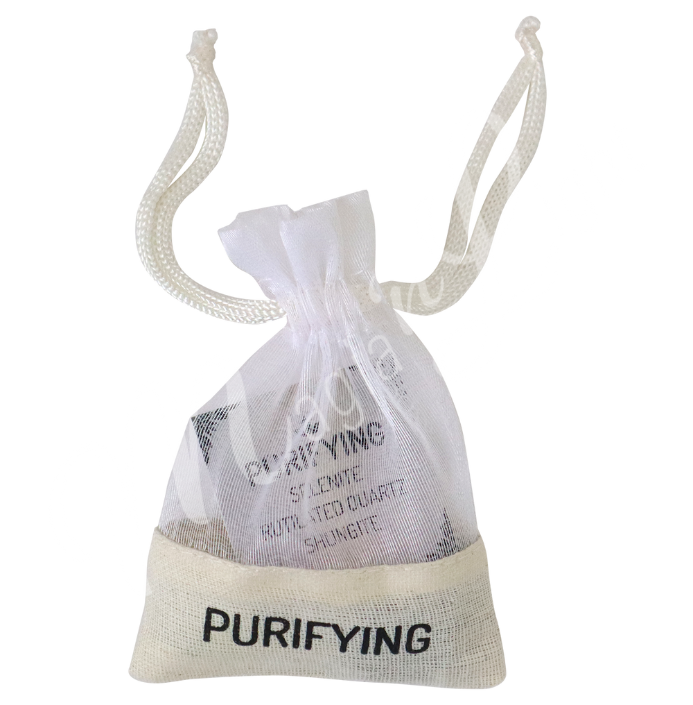 A small white drawstring pouch labeled “PURIFYING”.