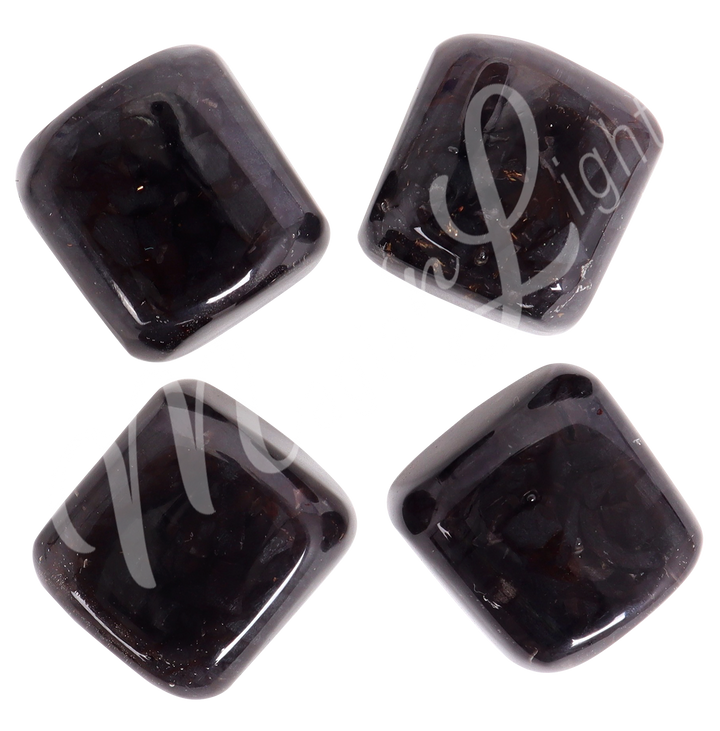 Four tumbled stones of Lodestone arranged in a circular pattern.