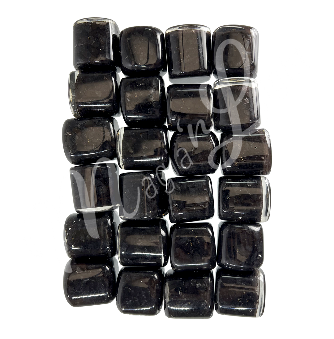 Collection of polished tumbled stones in shades of gray and black arranged together in a rectangular pattern.