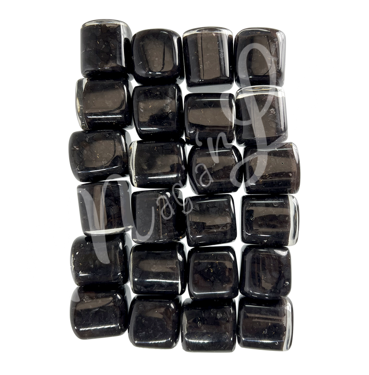 Collection of polished tumbled stones in shades of gray and black arranged together in a rectangular pattern.