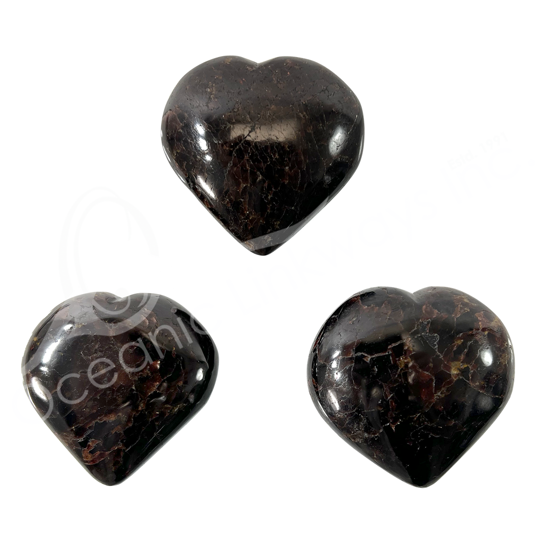 Three heart-shaped garnet crystal.