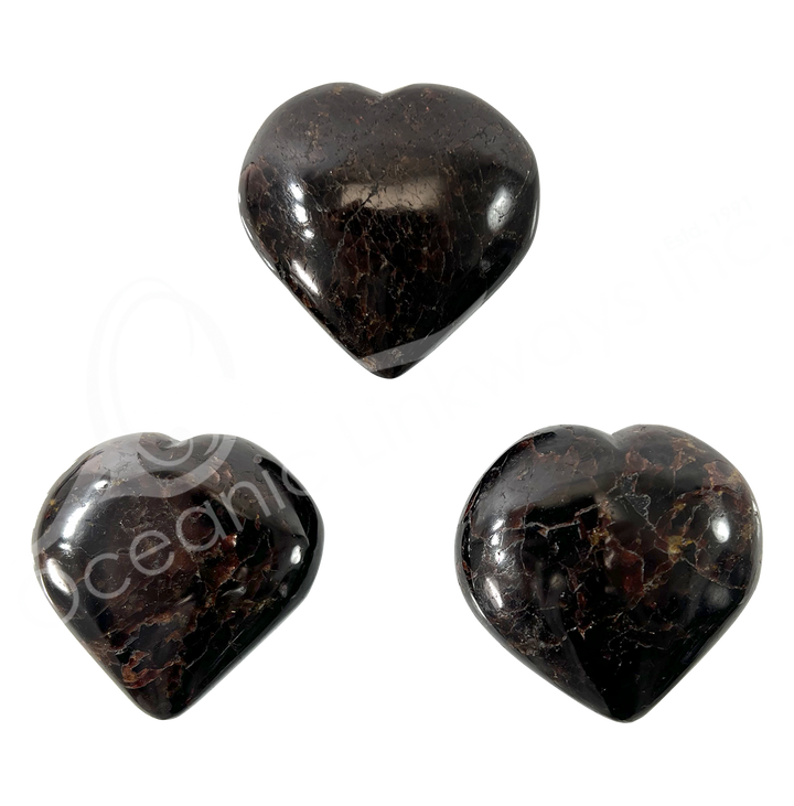 Three heart-shaped garnet crystal.