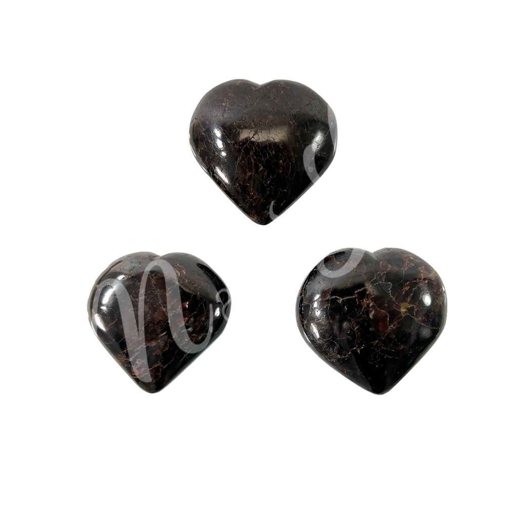 Three heart-shaped garnet crystal.