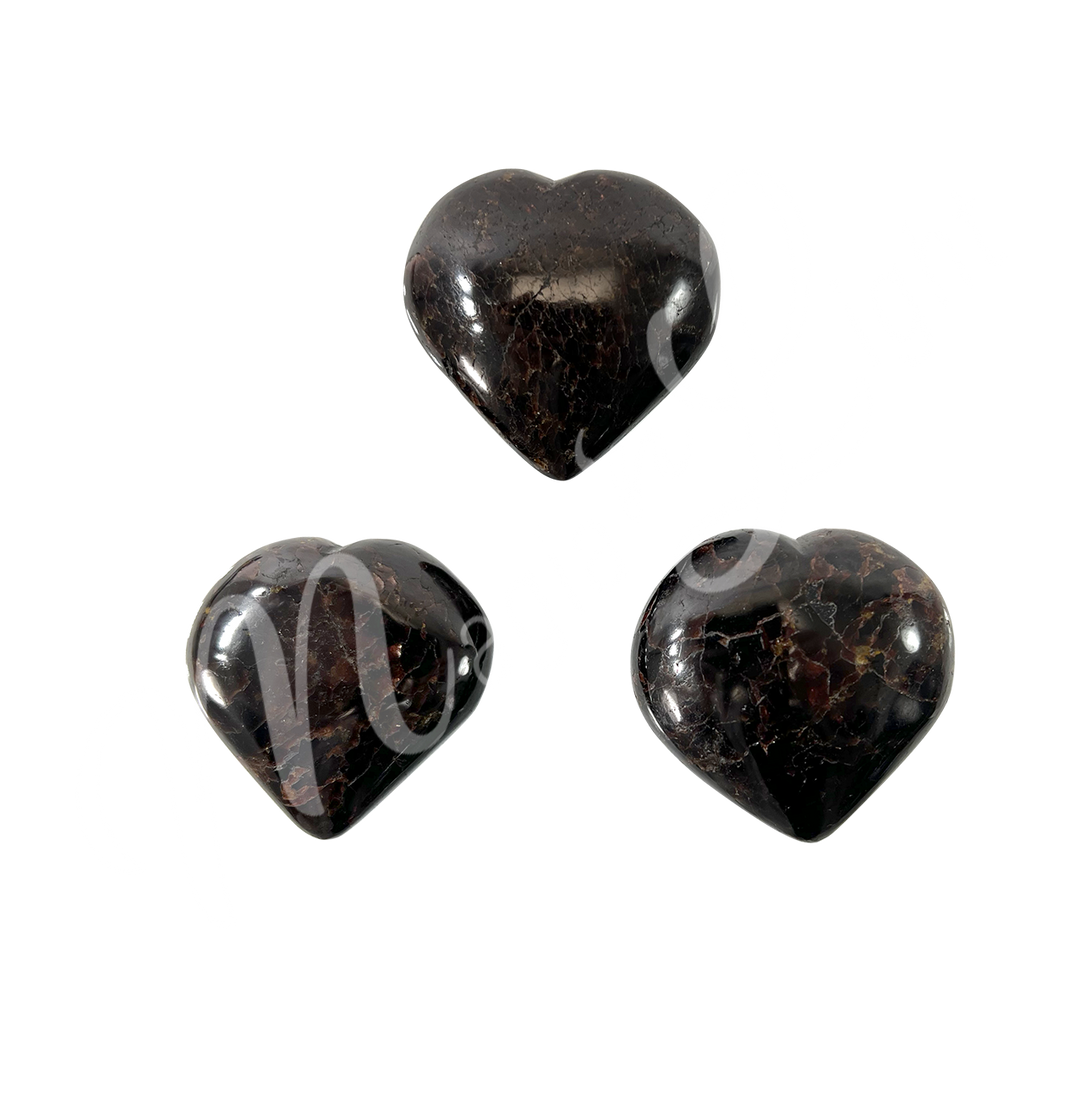 Three heart-shaped garnet crystal.