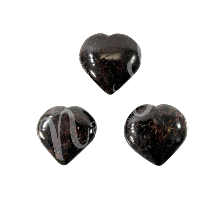 Three heart-shaped garnet crystal.