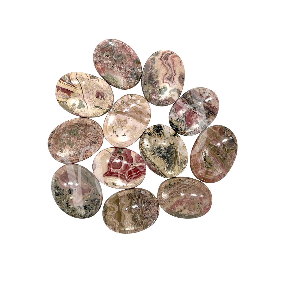 A collection of polished pink and brown and red stones with smooth oval shapes, showing natural color variations and patterns.
