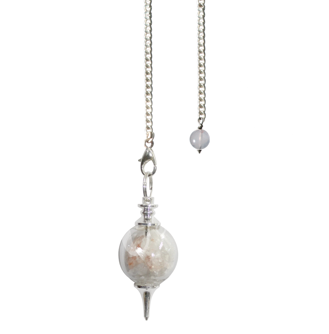 Silver pendulum with a spherical clear chamber filled with Salt & Selenite chips, finished with a pointed metal tip and suspended from a silver chain with a small round bead at the end.