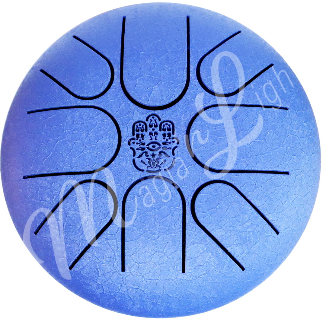 A top view of a blue iron tongue drum with a speckled finish, featuring multiple U-shaped cutout tongues and a hand of fatima symbol in the center.