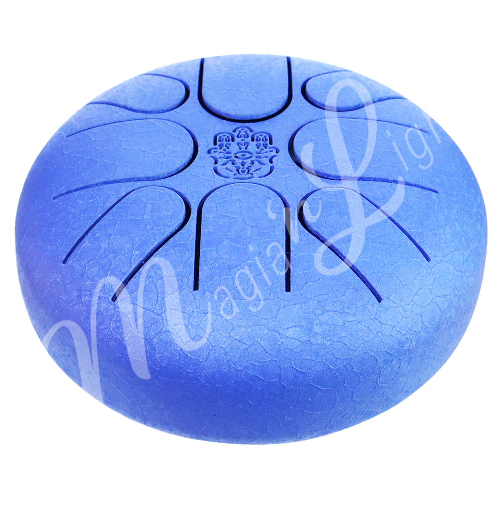 A blue iron tongue drum with a speckled finish, featuring multiple U-shaped cutout tongues and a hand of fatima symbol in the center. Seen with an angle.