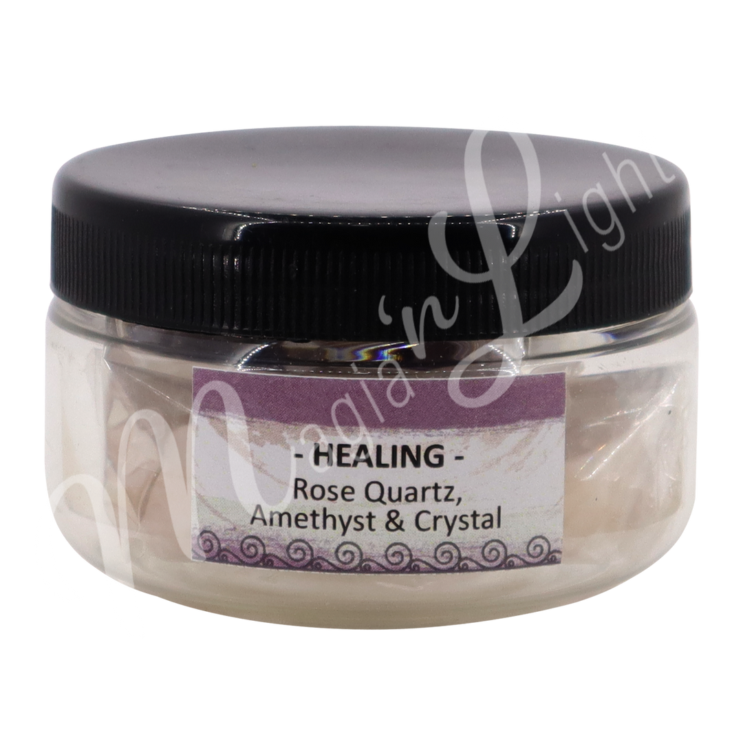 transparent jar with black lid. The label reads "Healing" "Rose Quartz, Amethyst & Crystal".