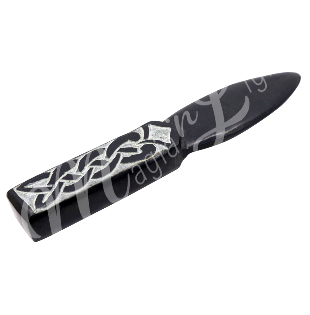 Athame made from Black Soapstone with an Celtic Knot engraving on the handle. Measuring 7" in length. Seen at an angle.