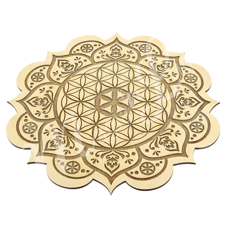 A flower of life acacia wood cystal grid engraved seen with an angle. 