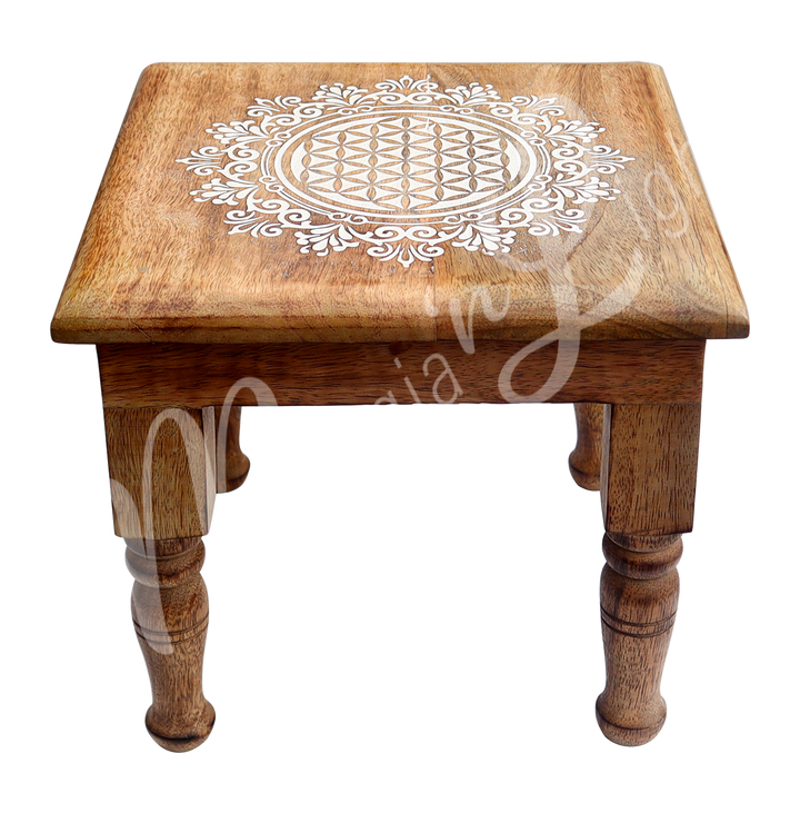 Square Mango Wood Altar Table Engraved with Flower of Life. Seen at an angle.