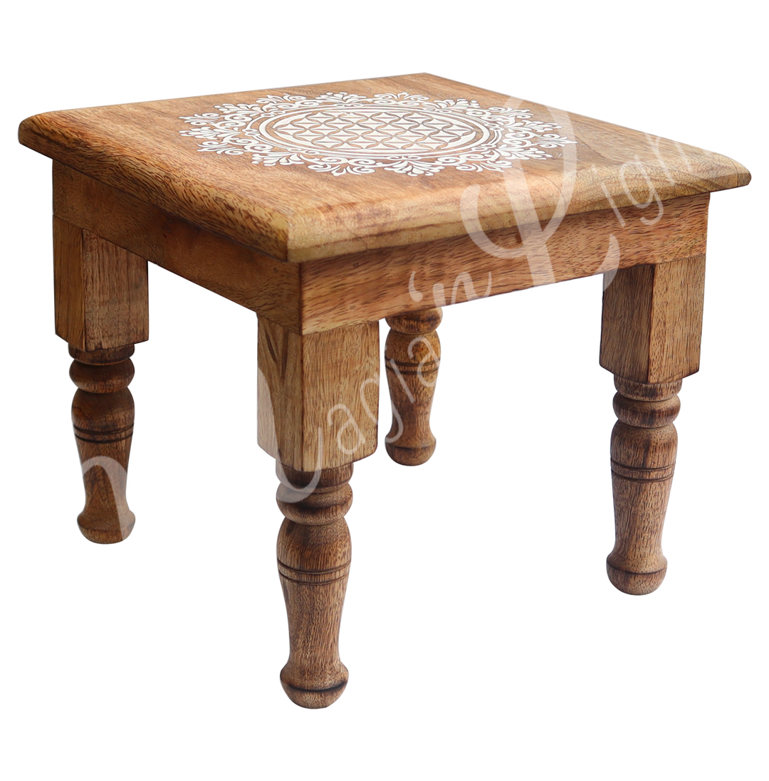 Square Mango Wood Altar Table Engraved with Flower of Life. Seen at an angle.