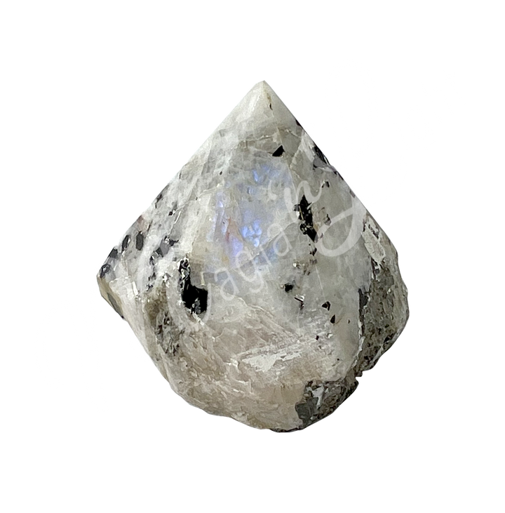 A piece of white stone with black specks. The top is cut to form a point.