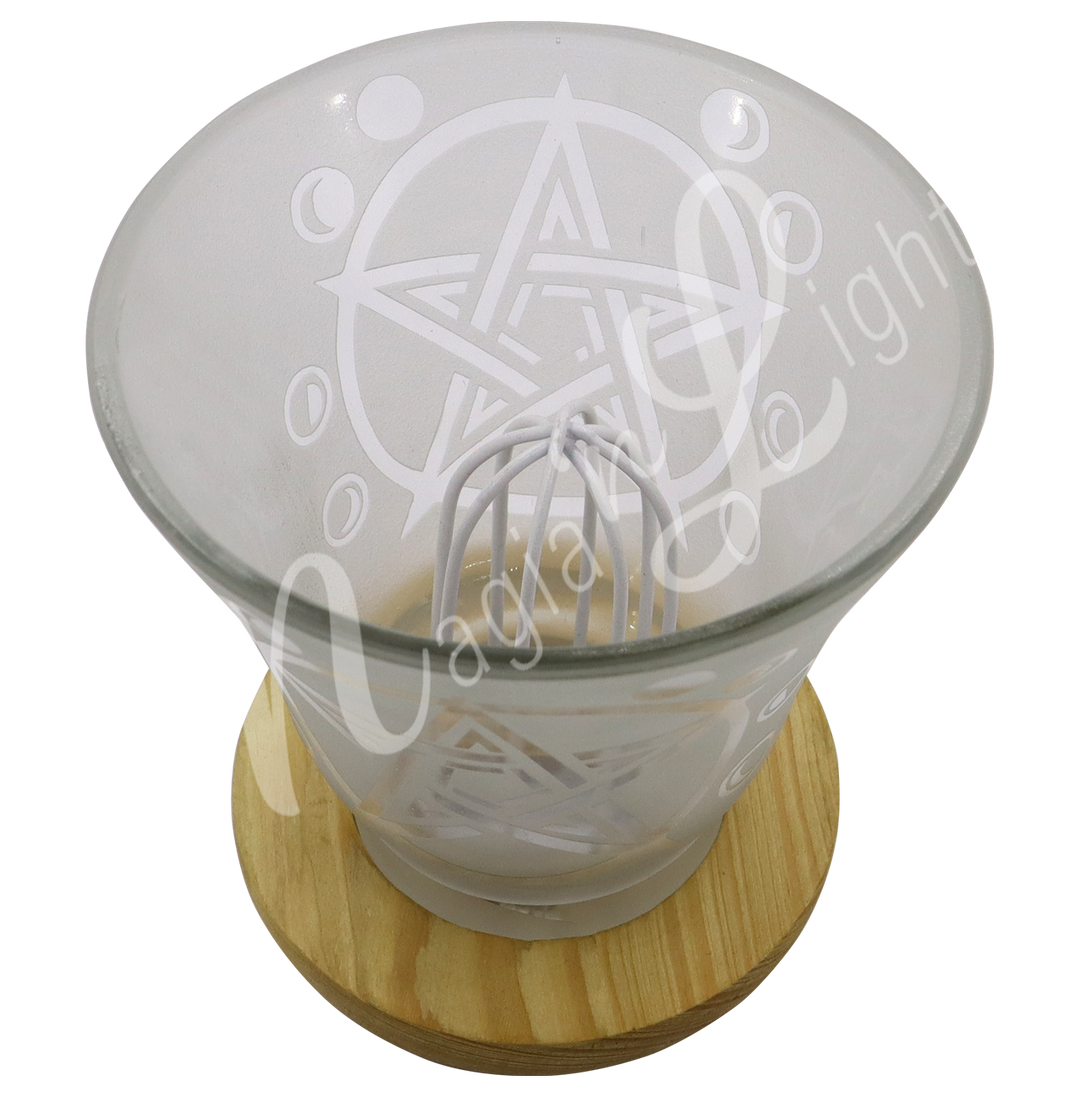Empty decorative frosted glass cup lamp with etched pentacle design, wooden base, metal piece in the middle.