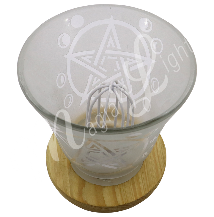Empty decorative frosted glass cup lamp with etched pentacle design, wooden base, metal piece in the middle.