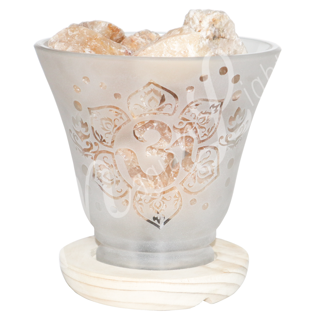 Decorative frosted glass lamp with etched OM in a lotus flower design, wooden base, and filled with citrine crystals.