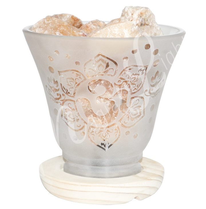 Decorative frosted glass lamp with etched OM in a lotus flower design, wooden base, and filled with citrine crystals.