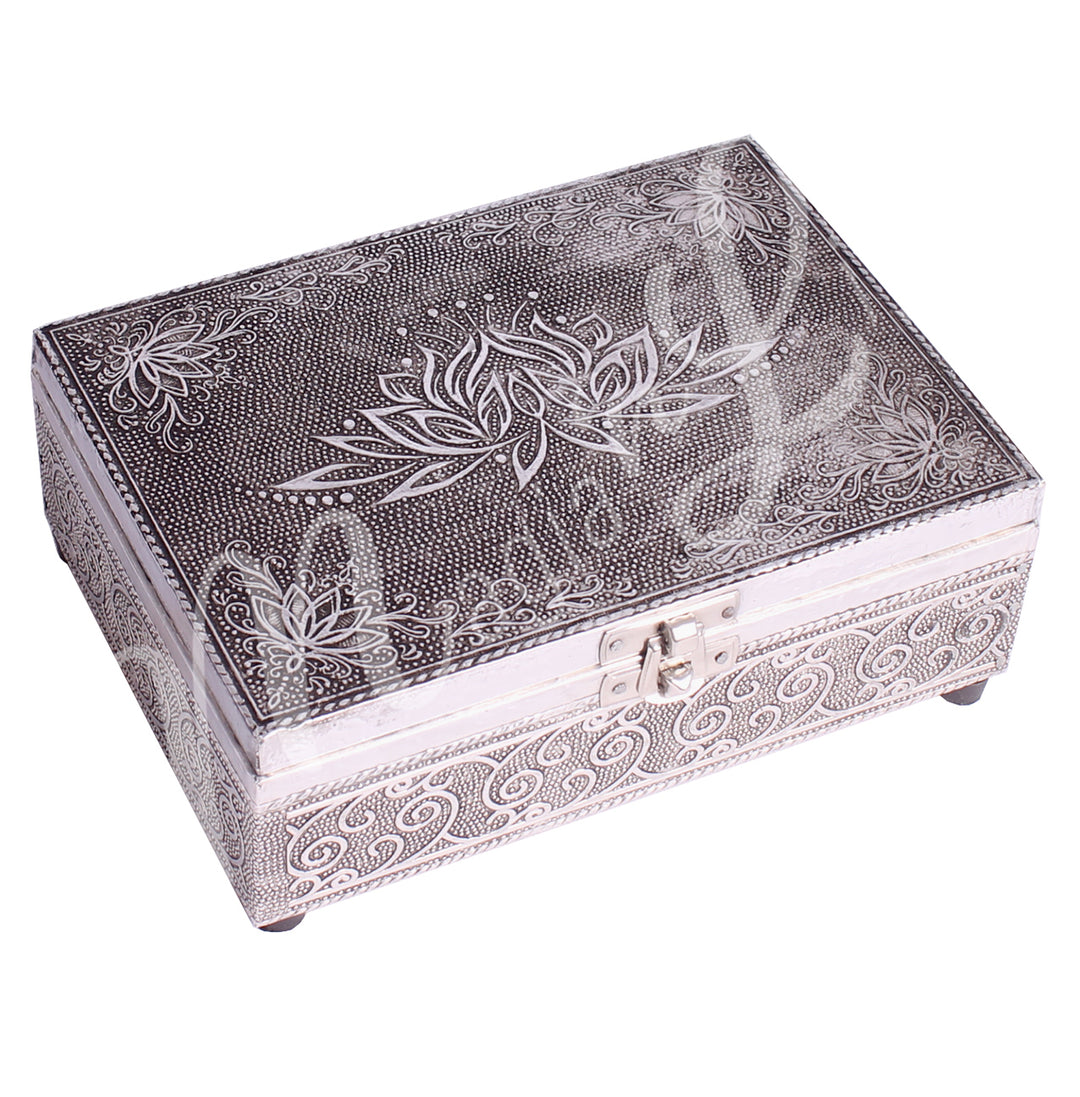 A metal box features a lotus flower on the lid.