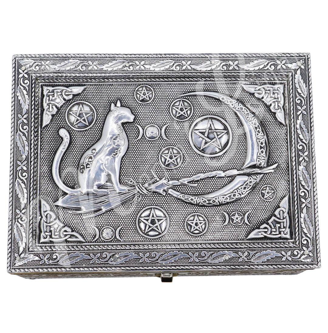 The lid features a cat on a witch's broom and various pentacle and a Celtic moon. 