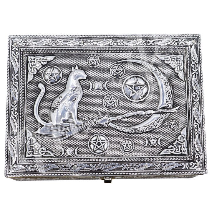 The lid features a cat on a witch's broom and various pentacle and a Celtic moon. 