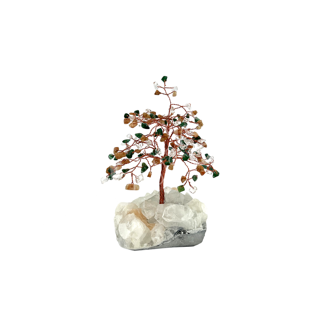 A wire gemstone bonsai tree with green, orange and clear crystal chips, mounted on a natural stilbite cluster base.