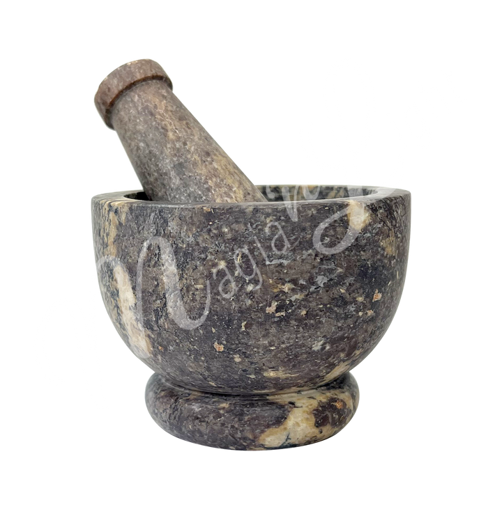 Natural soapstone mortar and pestle set. Seen from the side.