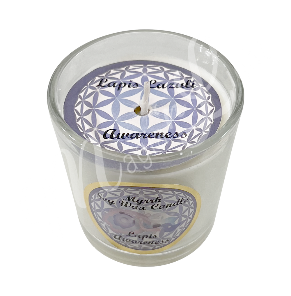 White soy wax candle in a glass holder, labeled "Myrrh Soy Wax Candle – Lapis, Awareness.