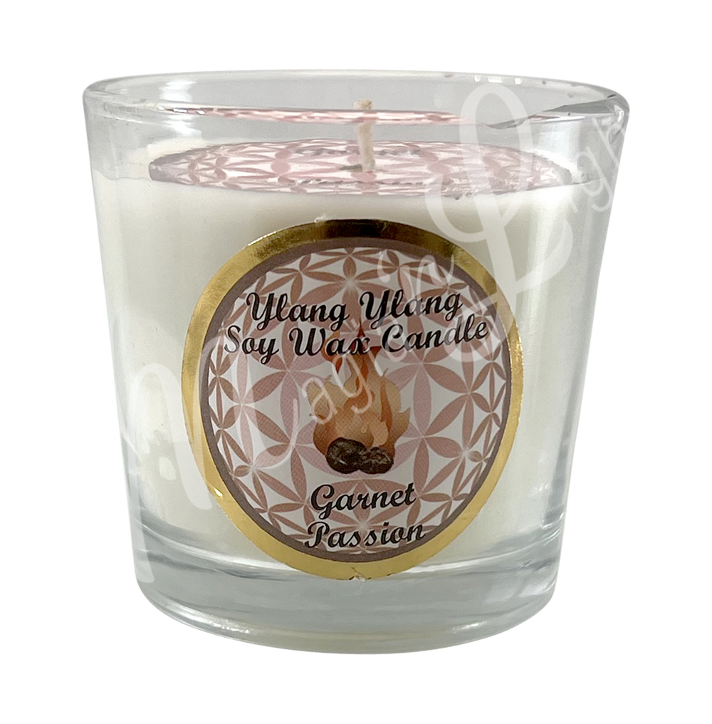 White soy wax candle in a glass holder, labeled "Ylang Ylang Soy Wax Candle – Garnet, Passion.