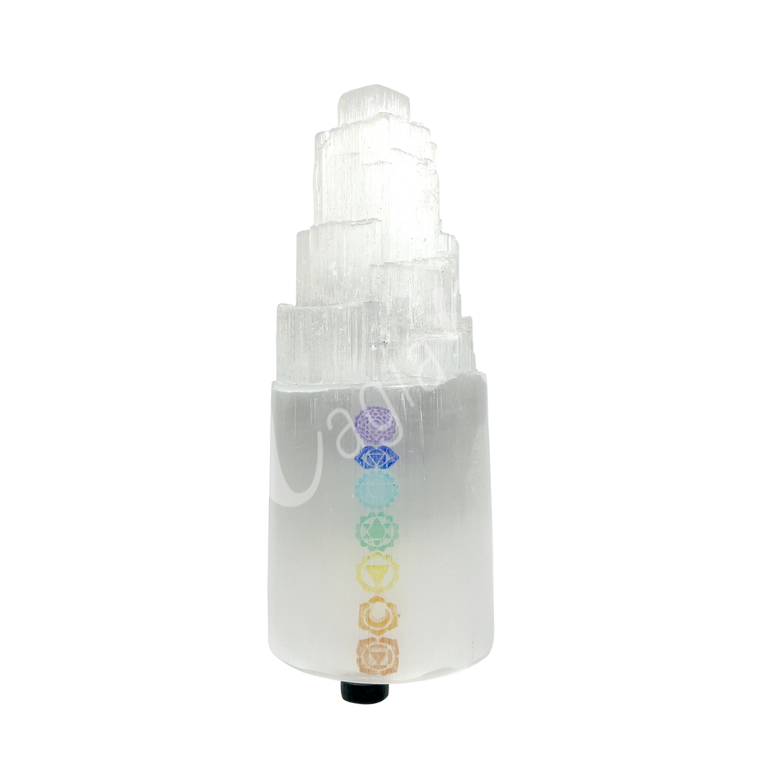 Selenite iceberg carving with black rubber feet. The lamp is engraved of the chakra symbol.