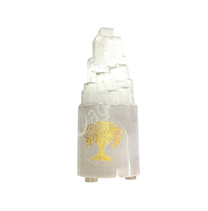Selenite iceberg carving with white rubber feet. The lamp is engraved with a gold Tree of Life.
