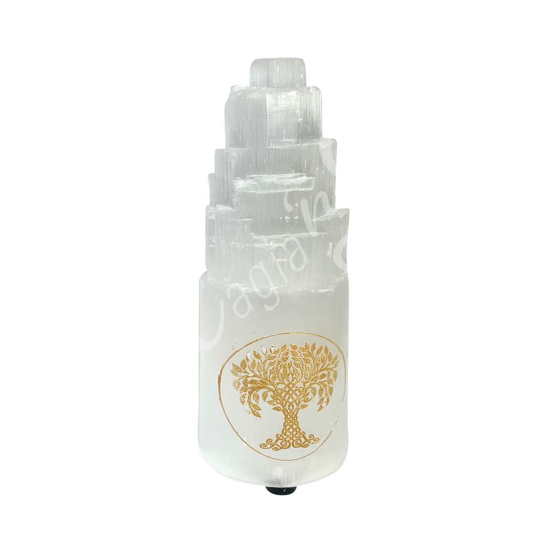 Selenite iceberg carving with white rubber feet. The lamp is engraved with a gold Tree of Life, seen with an other angle.